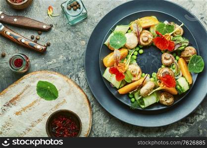 Salad with stewed mushrooms, cucumber,tomato and nasturtium.. Mushroom salad with vegetables