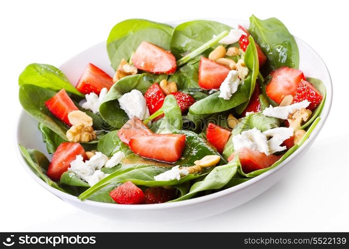salad with strawberry, spinach leaves and feta cheese on white background