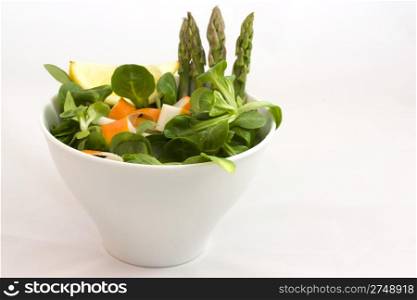 salad with surimi. a cup of salad with surimi and asparagus
