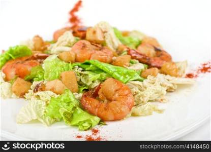 Salad with tiger shrimps and vegetable closeup