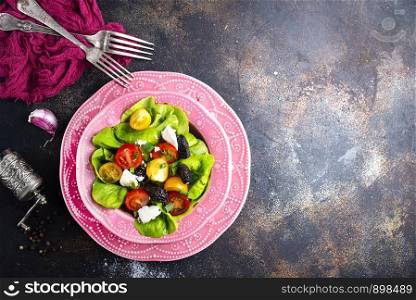 salad with tomato cheese and black olives