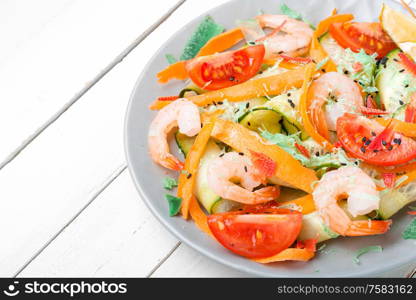 Salad with tomato, cucumber and shrimp.Seafood vegetable salad. Salad with shrimp and vegetables