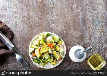 salad with vegetables and avocado on plate