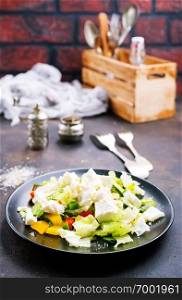 salad with vegetables and cheese on plate