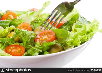 salad with vegetables and greens on white background