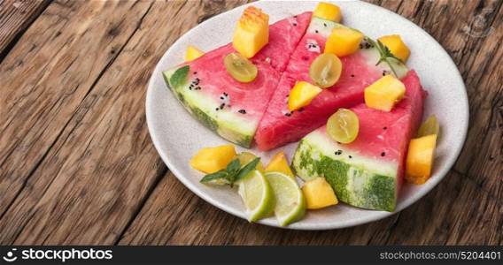 salad with watermelon. vegetarian dessert salad with watermelon,lime and grapes