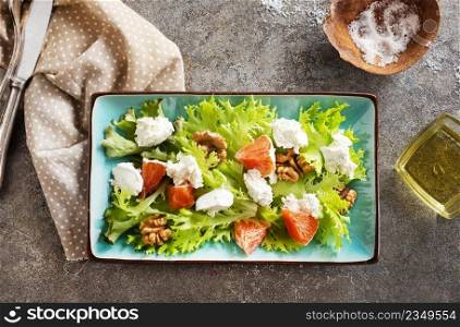 salad with white cheese and vegetables on plate