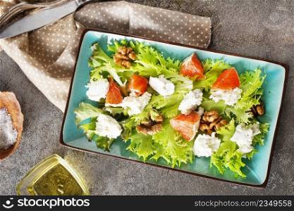 salad with white cheese and vegetables on plate