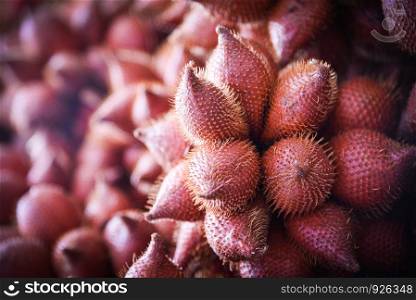 Salak Palm or snake fruit for sale in the fruit market / Salacca zalacca