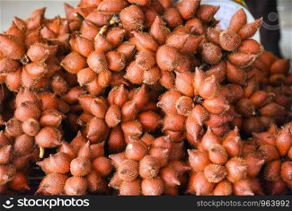 Salak Palm or waive or snake fruit for sale in the fruit market / Salacca zalacca
