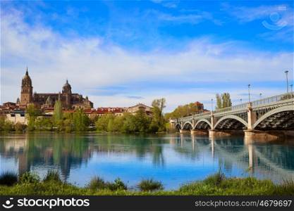 Salamanca skyline in Enrique Estevan bridge over Tormes river in Spain