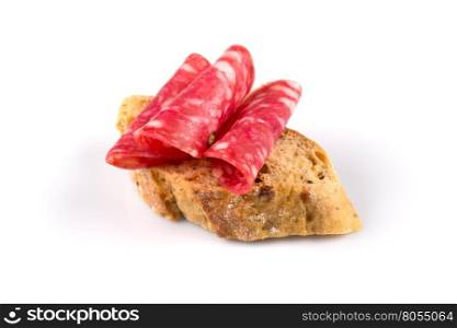 Salami on ciabatta. Sandwich of salami slices on whole grain bread.