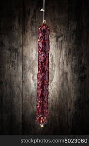 salami . salami on a wooden background