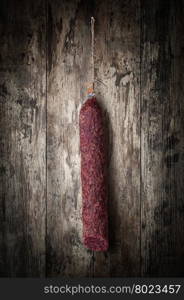 salami sausages. salami sausages on a wooden background