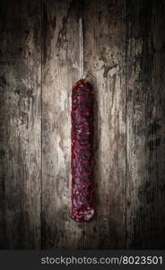 salami sausages. salami sausages on a wooden background