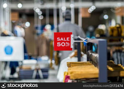 sale 50  off mock up advertise display frame setting over the clothes line in the shopping department store for shopping, business fashion and advertisement concept