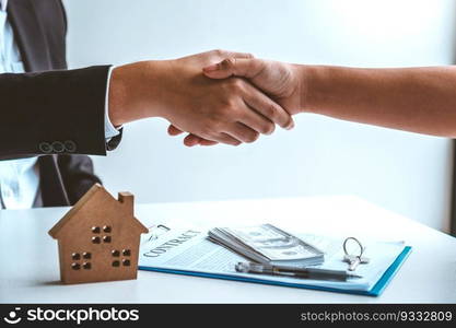 Sale Agent handshake with woman customer and sign agreement documents for realty purchase after successful loan contract