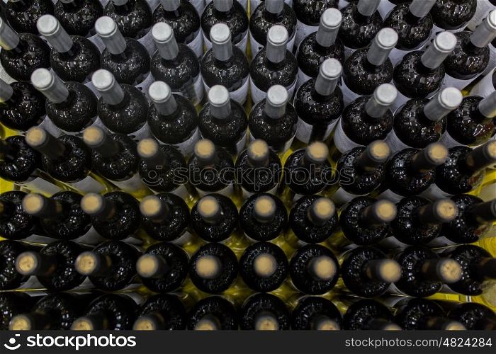 sale and alcohol concept - close up of bottles at liquor store. close up of bottles at liquor store