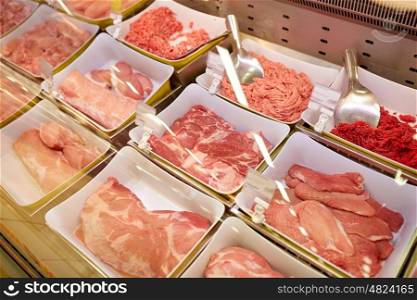 sale and food concept - meat in bowls at grocery stall. meat in bowls at grocery stall