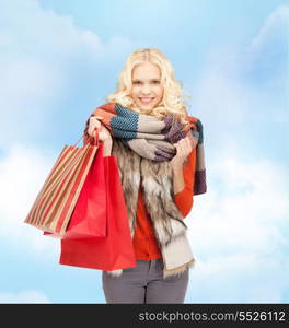 sale and shopping concept - lovely teenage girl with shopping bags