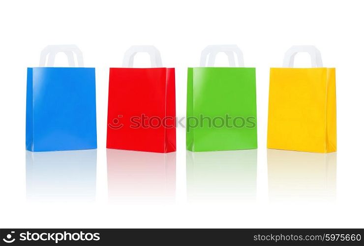 sale, consumerism, advertisement and retail concept - many blank colorful shopping bags