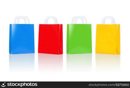 sale, consumerism, advertisement and retail concept - many blank colorful shopping bags