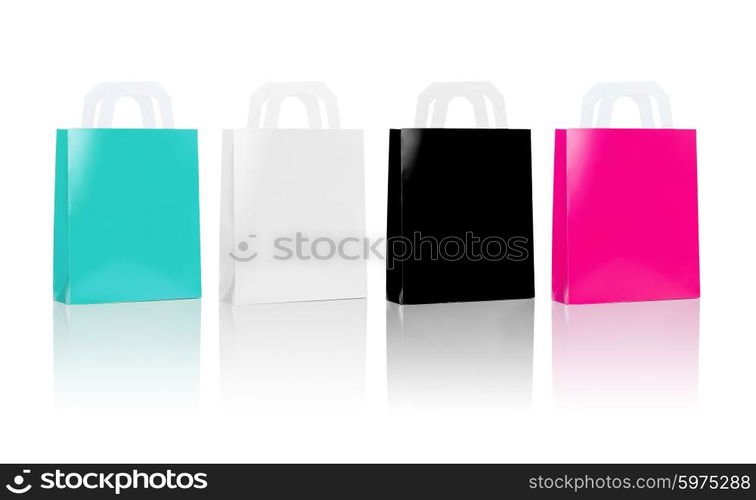 sale, consumerism, advertisement and retail concept - many blank shopping bags, blue white black pink color