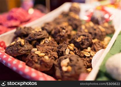 sale, cooking and food concept - chocolate cookies with peanuts. chocolate cookies with peanuts