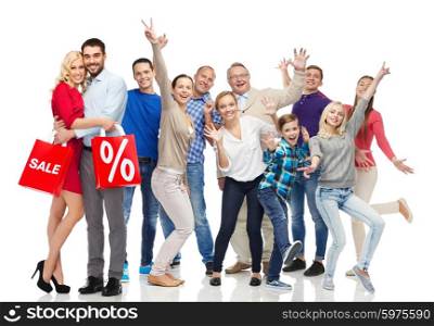 sale, discount, happiness and people concept - happy people with shopping bags having fun