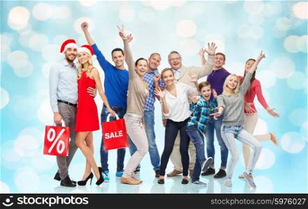 sale, discount, happiness and people concept - happy people with shopping bags having fun