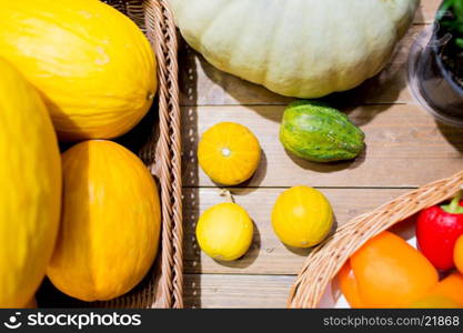 sale, farming, agriculture and eco food concept - ripe vegetables in baskets on table at grocery market or farm