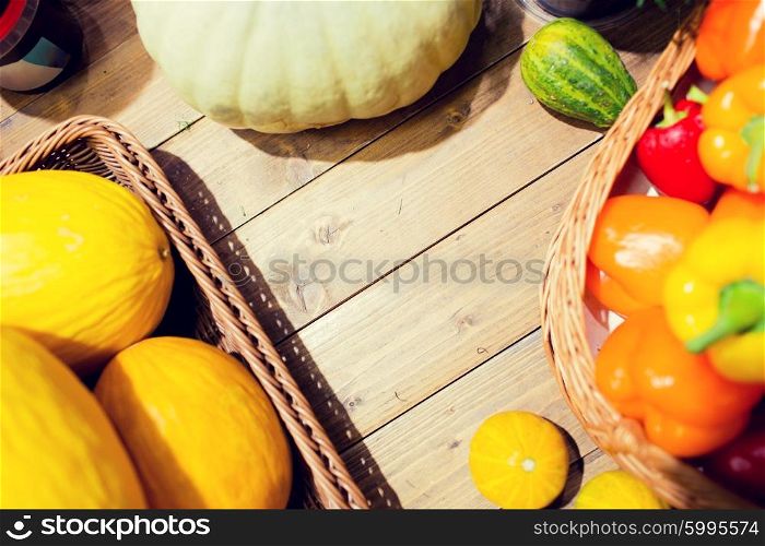 sale, farming, agriculture and eco food concept - ripe vegetables in baskets on table at grocery market or farm