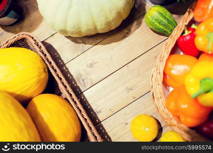 sale, farming, agriculture and eco food concept - ripe vegetables in baskets on table at grocery market or farm