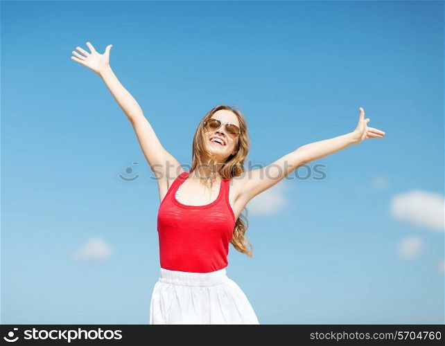 sale, gifts, christmas, holidays and people concept - smiling woman with colorful shopping bags over lights background