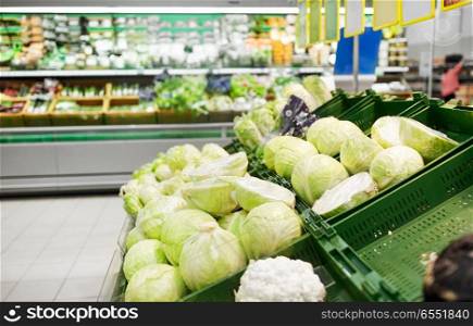 sale, harvest, food, vegetables and agriculture concept - close up of cabbage at grocery store or market. close up of cabbage at grocery store or market. close up of cabbage at grocery store or market