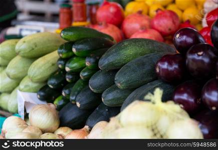 sale, harvest, food, vegetables and agriculture concept - close up of squash at street farmers market