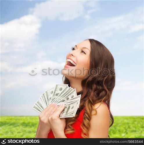 sale, nature, banking and people concept - smiling woman in red dress with us dollar money