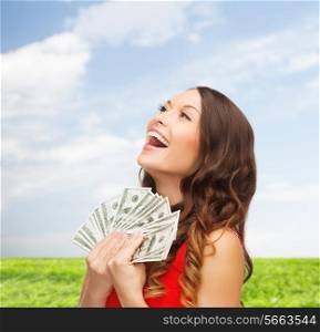sale, nature, banking and people concept - smiling woman in red dress with us dollar money