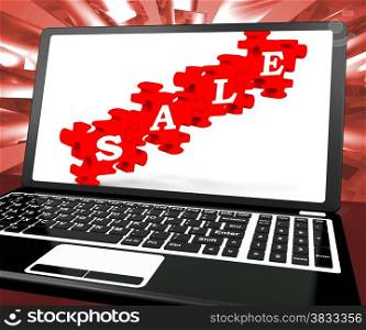 . Sale Puzzle On Laptop Shows Price Discounts And Online Promotions