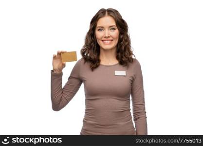 sale, shopping and business concept - happy female shop assistant holding golden credit card over white background. happy female shop assistant with credit card