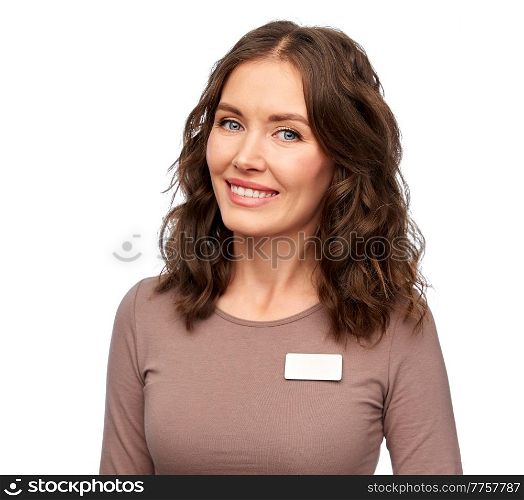 sale, shopping and business concept - happy female shop assistant with name tag over white background. happy female shop assistant with name tag