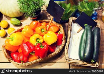 sale, shopping and eco food concept - ripe vegetables in baskets with nameplates at grocery market