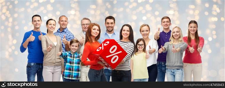 sale, shopping, family, generation and people concept - group of happy men and women showing thumbs up and percent sign over holidays lights background