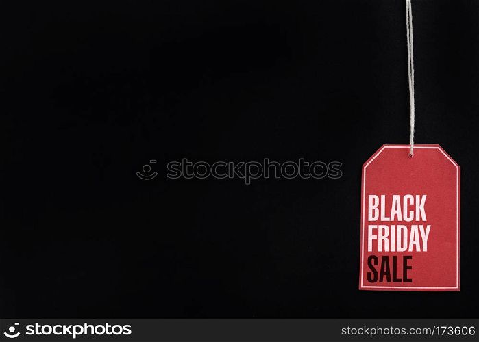 Sale tag with discount witen in it on black background. Black friday concept