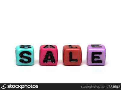 sale - word made from multicolored child toy cubes with letters