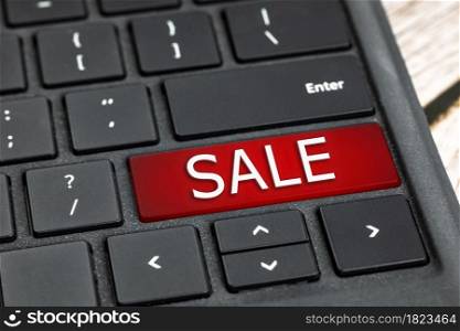 SALE written on black computer keyboard with red and white text, Shopping online,black Friday concept technology. SALE written on black computer keyboard with red and white text, Shopping online,black Friday concept