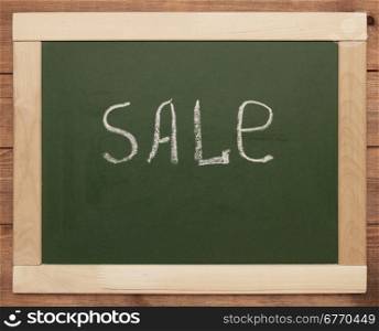""sale" written on blackboard"