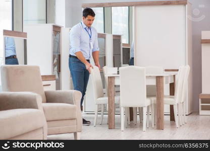 Sales assistant in furniture store