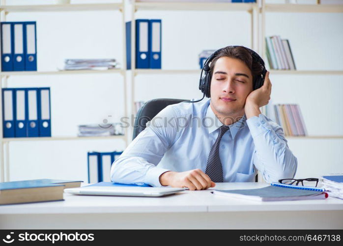 Sales assistant listening to music during lunch break