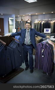 Sales associate in menswear store in mall